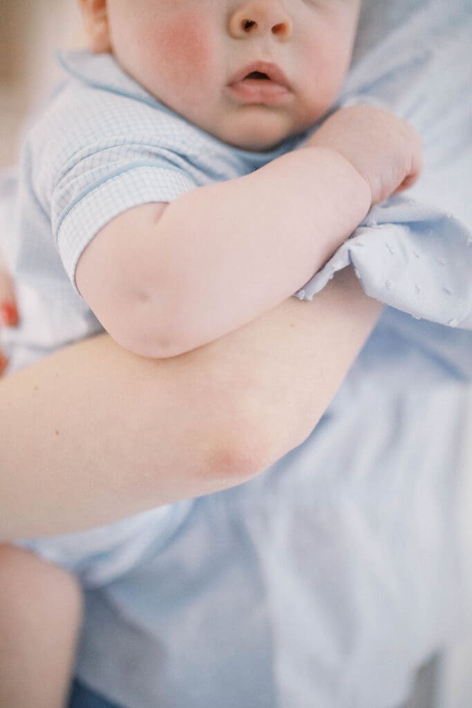 Lifestyle Newborn Photo of baby and mom's arms intertwined
