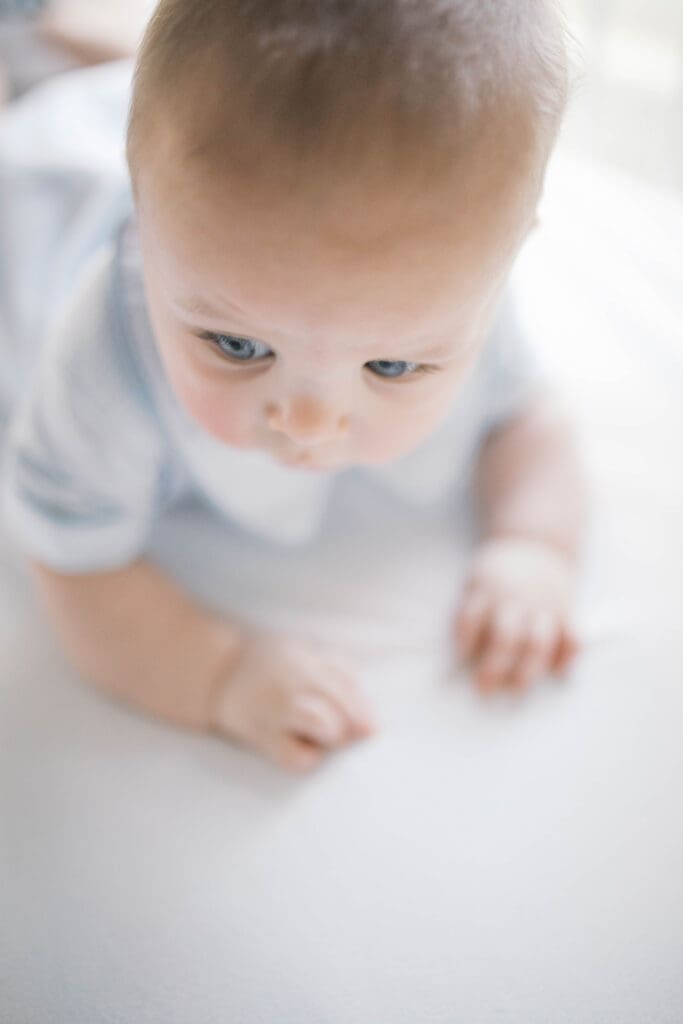 Lifestyle Newborn Photo of baby during tummy time in his crib