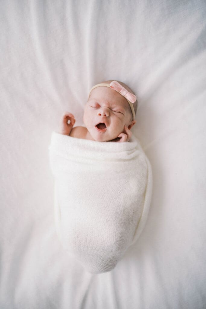 Close-up detail photo of newborn baby yawning during Jacksonville newborn session