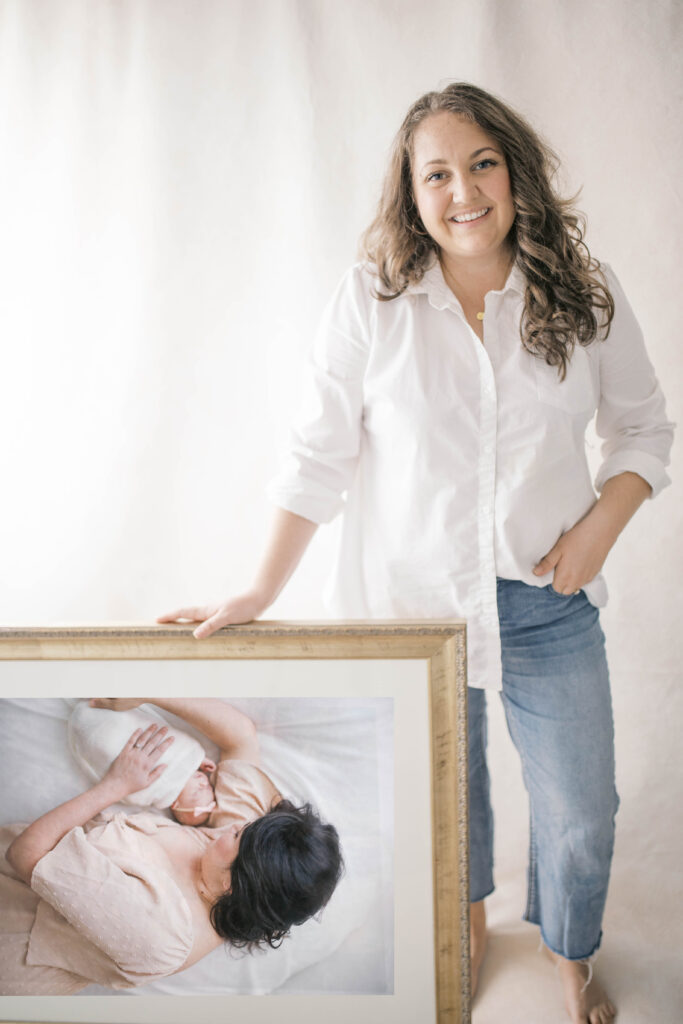 Rebecca Paige Newborn Photographer showcasing a custom framed piece of art from a newborn session in Jacksonville